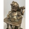 SCULTURA Vincenzo Bertolotti BIMBA SEGGIOLONE GESSO PATINATO COLOR BRONZO '20