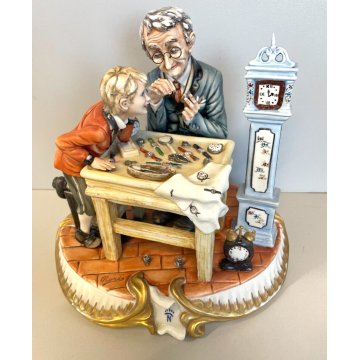 SCULTURA CERAMICA Capodimonte OROLOGIAIO FIGURA BAMBINO BISCUIT SMALTO ANNI 80