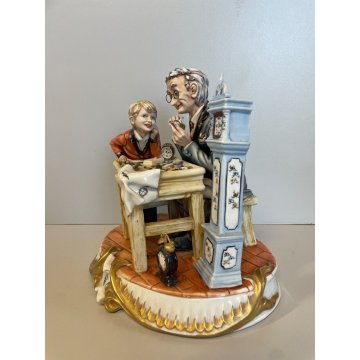 SCULTURA CERAMICA Capodimonte OROLOGIAIO FIGURA BAMBINO BISCUIT SMALTO ANNI 80