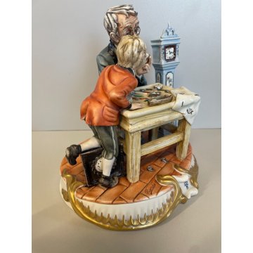 SCULTURA CERAMICA Capodimonte OROLOGIAIO FIGURA BAMBINO BISCUIT SMALTO ANNI 80